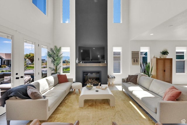 6927 W Higbrow Way S, Jordan, UT 84009 - living room with a towering ceiling and a glass covered fireplace