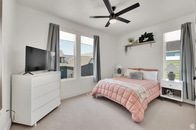 6927 W Higbrow Way S, Jordan, UT 84009 - bedroom with multiple windows, light carpet, and a ceiling fan