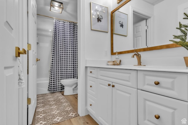 1960 N Lake Dr, Scofield, UT 84526 - full bath with vanity, wood finished floors, and shower / bath combo with shower curtain
