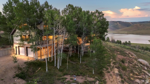 1960 N Lake Dr, Scofield, UT 84526 - view of yard featuring a water view, a garage, and dirt driveway