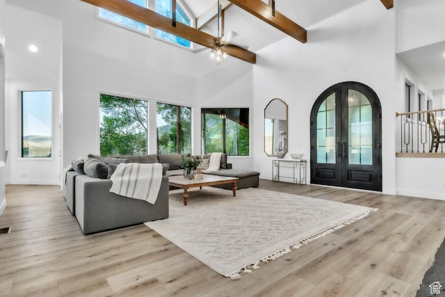 1960 N Lake Dr, Scofield, UT 84526 - living area featuring high vaulted ceiling, ceiling fan, french doors, beamed ceiling, and light wood finished floors