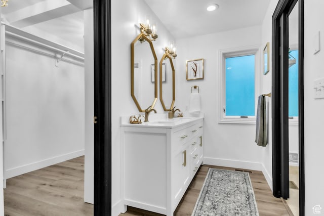 1960 N Lake Dr, Scofield, UT 84526 - bathroom featuring double vanity, wood finished floors, and recessed lighting