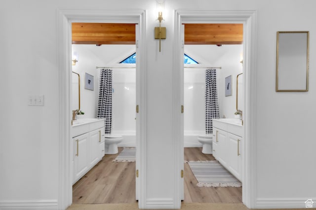 1960 N Lake Dr, Scofield, UT 84526 - bathroom with vanity, shower / bath combo with shower curtain, wood finished floors, and vaulted ceiling