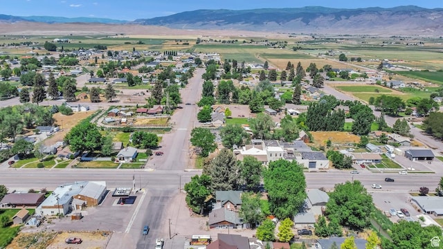 340 N Main St, Monroe, UT 84754 - aerial view of property and surrounding area featuring mountains and nearby suburban area