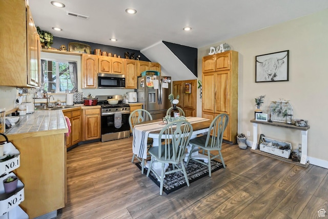 340 N Main St, Monroe, UT 84754 - kitchen featuring appliances with stainless steel finishes, tile countertops, recessed lighting, and wood finished floors