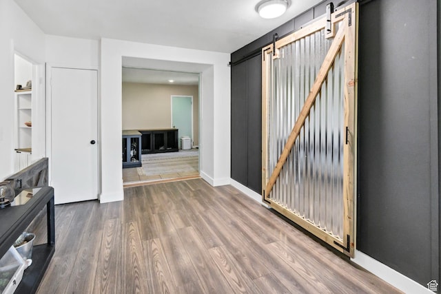 340 N Main St, Monroe, UT 84754 - empty room with a barn door and wood finished floors