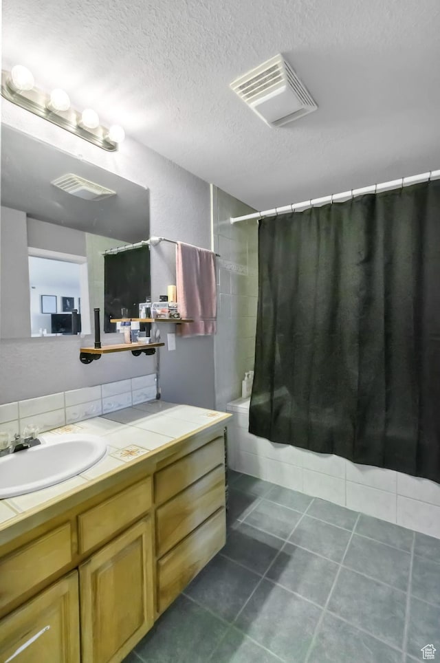 340 N Main St, Monroe, UT 84754 - full bathroom featuring shower / bathtub combination with curtain, vanity, tile patterned flooring, and a textured ceiling