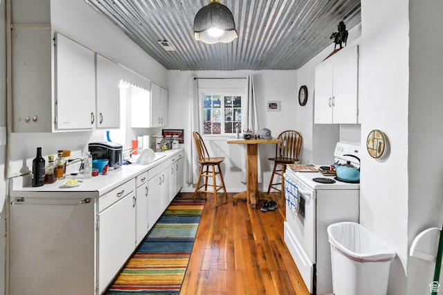 340 N Main St, Monroe, UT 84754 - kitchen featuring white electric stove, white cabinetry, light countertops, and wood-type flooring