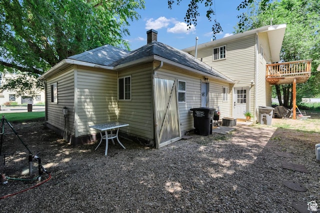 340 N Main St, Monroe, UT 84754 - rear view of property featuring a chimney and roof with shingles