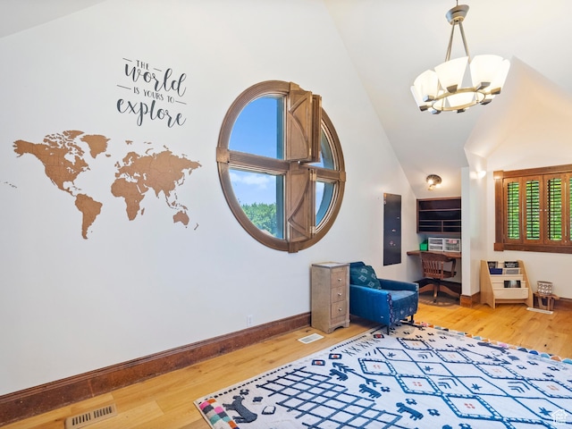 2586 S 1825 E, Ogden, UT 84401 - entryway featuring wood finished floors, a chandelier, and high vaulted ceiling