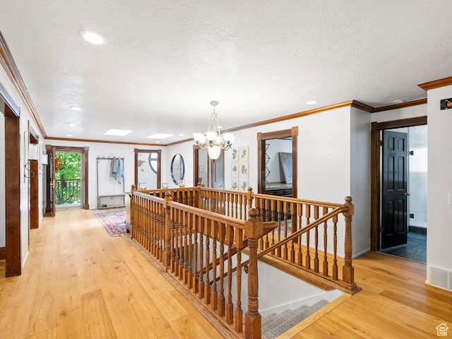 2586 S 1825 E, Ogden, UT 84401 - hallway featuring an upstairs landing, ornamental molding, light wood finished floors, a chandelier, and recessed lighting