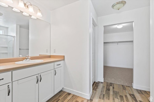 635 E Mayor Place Dr, American Fork, UT 84003 - full bathroom featuring vanity, a spacious closet, wood finished floors, and a shower