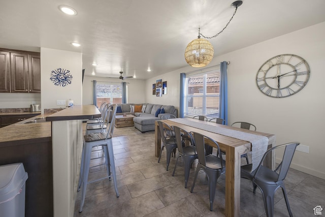 3853 Red Valley Cir Unit 22A1, Moab, UT 84532 - dining space with a chandelier, tile patterned floors, and recessed lighting