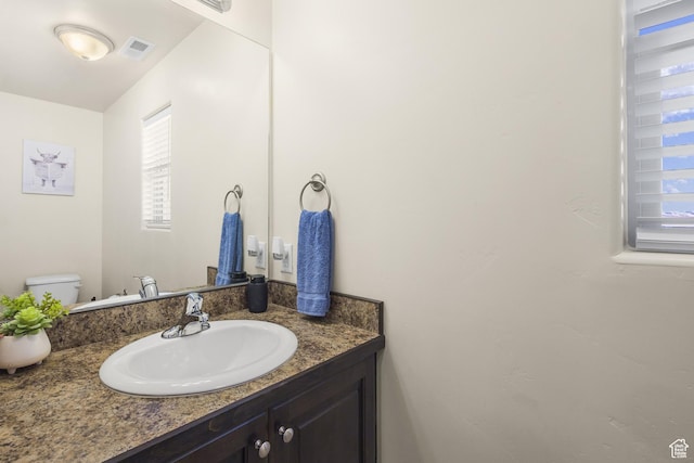 3853 Red Valley Cir Unit 22A1, Moab, UT 84532 - bathroom featuring vanity and toilet