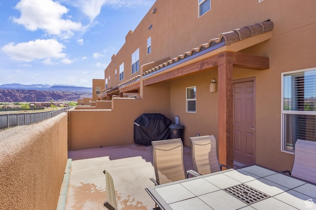 3853 Red Valley Cir Unit 22A1, Moab, UT 84532 - view of patio / terrace featuring a mountain view and outdoor dining space