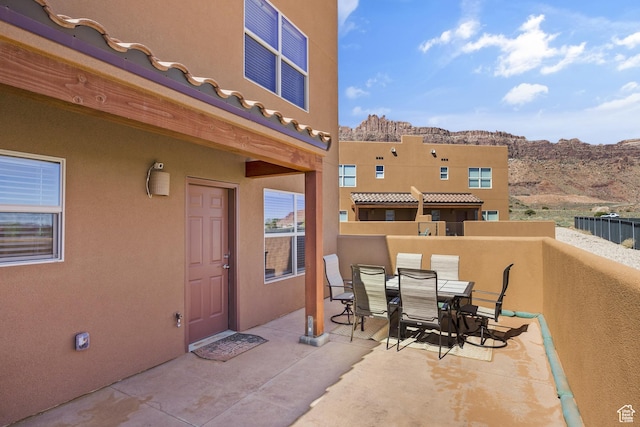 3853 Red Valley Cir Unit 22A1, Moab, UT 84532 - view of patio / terrace featuring outdoor dining space and a mountain view