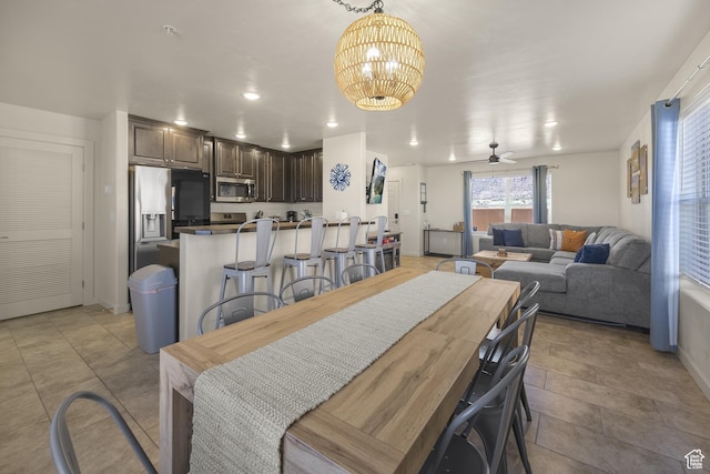 3853 Red Valley Cir Unit 22A1, Moab, UT 84532 - dining room featuring a chandelier, ceiling fan, recessed lighting, and light tile patterned flooring