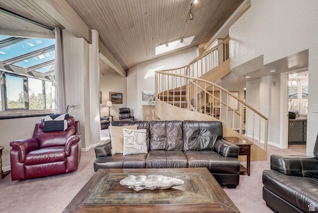 1485 Empire Ave Unit 513, Park City, UT 84060 - living room featuring stairway, carpet, wood ceiling, a skylight, and vaulted ceiling