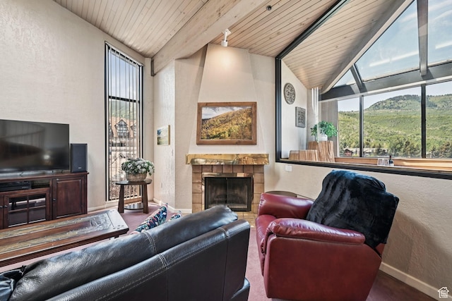1485 Empire Ave Unit 513, Park City, UT 84060 - living room featuring wood ceiling, a textured wall, and a tiled fireplace