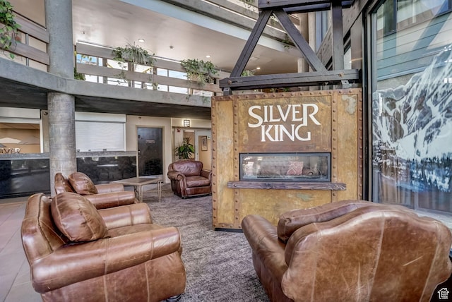 1485 Empire Ave Unit 513, Park City, UT 84060 - living area with a towering ceiling, carpet, and a fireplace