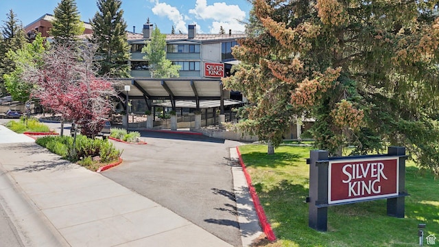 1485 Empire Ave Unit 513, Park City, UT 84060 - view of community featuring asphalt driveway, a carport, and a yard