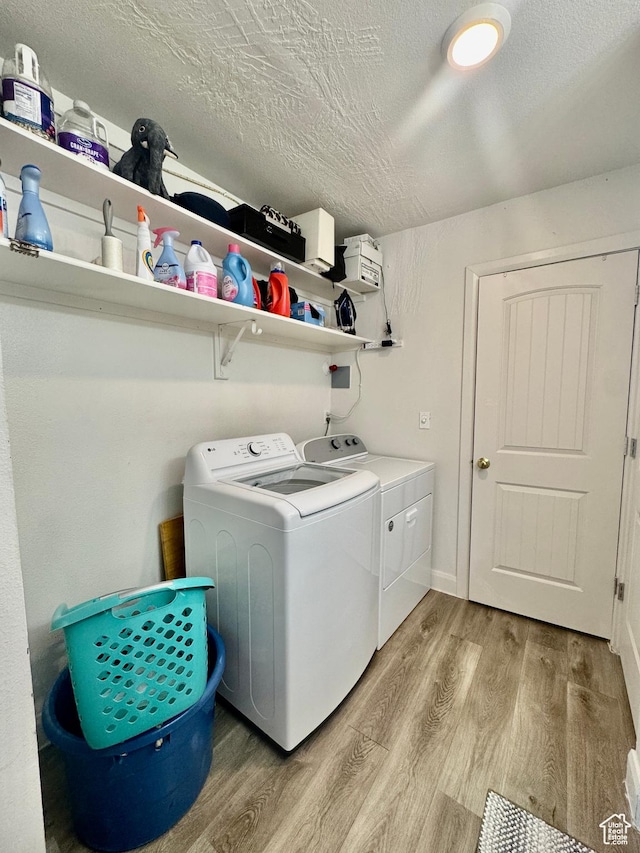 695 N 500 W Unit 14, St George, UT 84770 - laundry room with washer and clothes dryer, light wood finished floors, and a textured ceiling