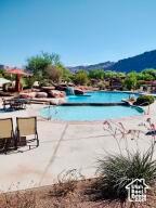 2466 W Cohonina Trl, St George, UT 84770 - community pool with a mountain view and a patio