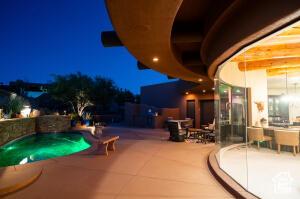 2466 W Cohonina Trl, St George, UT 84770 - pool at night with a patio