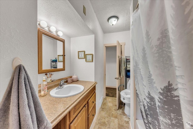 373 N 400 W, Cedar City, UT 84721 - full bathroom with vanity, stone finish flooring, a shower with shower curtain, and a textured ceiling