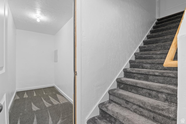 14907 S Messi St, Herriman, UT 84096 - stairway with a textured ceiling and carpet flooring