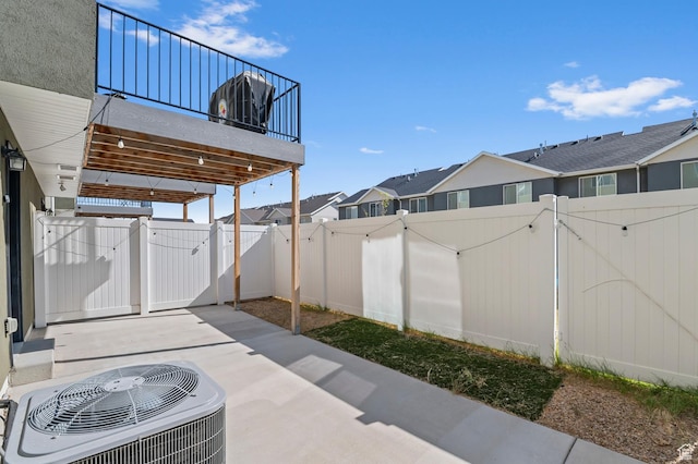 14907 S Messi St, Herriman, UT 84096 - fenced backyard with a gate, a patio area, and a residential view