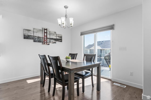 14907 S Messi St, Herriman, UT 84096 - dining room featuring a chandelier and wood finished floors