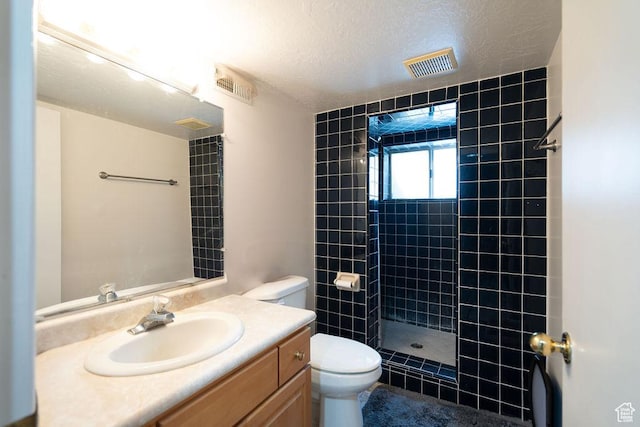 5465 W 5400 S, Kearns, UT 84118 - full bath featuring tiled shower, vanity, and a textured ceiling