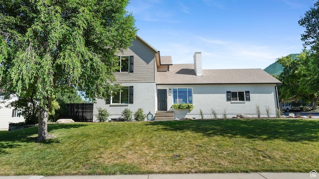 563 E 1840 N, Orem, UT 84097 - view of front of house with a chimney, brick siding, and entry steps