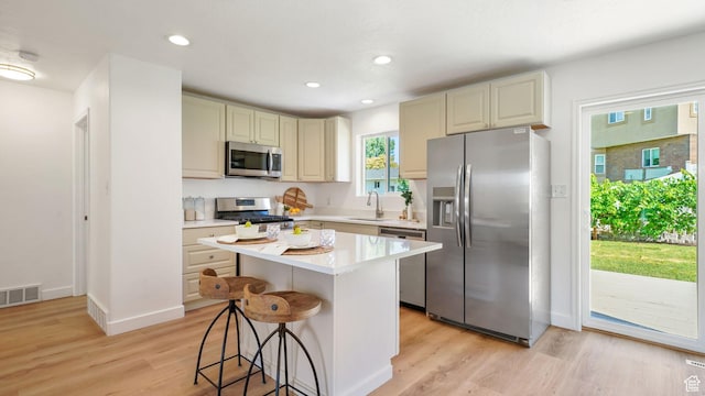 563 E 1840 N, Orem, UT 84097 - kitchen featuring stainless steel appliances, light wood finished floors, light countertops, a kitchen breakfast bar, and recessed lighting