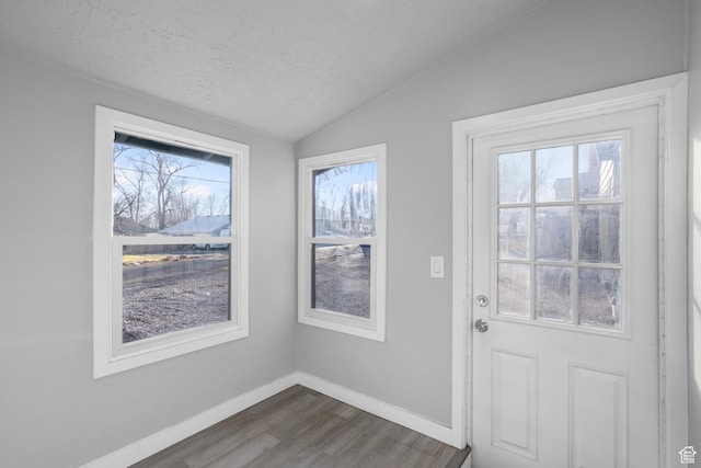3174 S 9100 W, Magna, UT 84044 - doorway with dark wood-style floors, a textured ceiling, and lofted ceiling