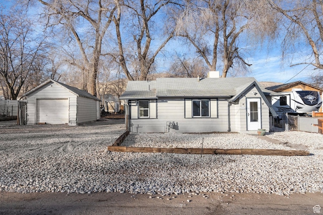 3174 S 9100 W, Magna, UT 84044 - single story home featuring a garage, an outbuilding, a shingled roof, and a chimney