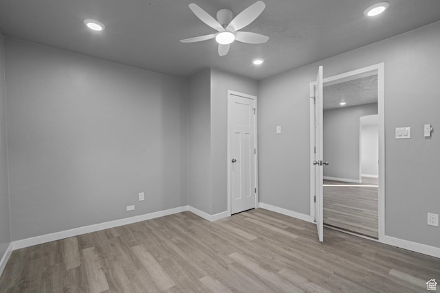 3174 S 9100 W, Magna, UT 84044 - unfurnished bedroom featuring wood finished floors, recessed lighting, and a ceiling fan