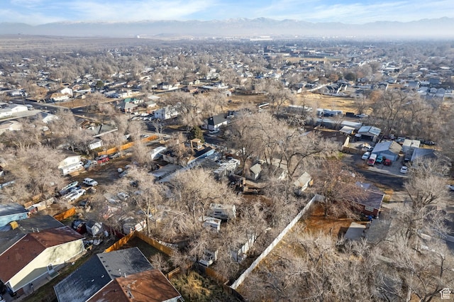 3174 S 9100 W, Magna, UT 84044 - aerial view of property and surrounding area featuring a mountainous background and nearby suburban area