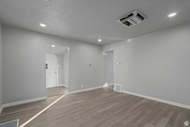 3174 S 9100 W, Magna, UT 84044 - empty room with wood finished floors, recessed lighting, and a textured ceiling