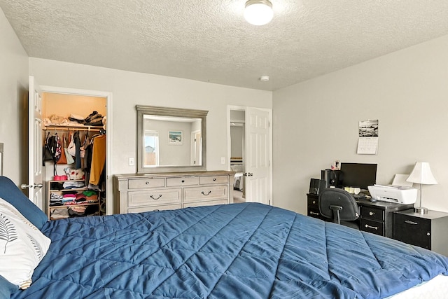 253 N 4300 W, Cedar City, UT 84720 - bedroom featuring a textured ceiling, a spacious closet, a closet, and an office area