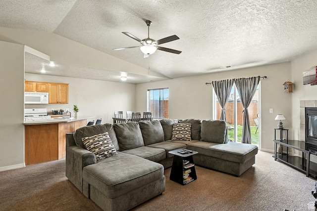 253 N 4300 W, Cedar City, UT 84720 - carpeted living room with lofted ceiling, a ceiling fan, a textured ceiling, and a tile fireplace