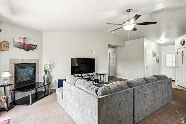 253 N 4300 W, Cedar City, UT 84720 - carpeted living area featuring a ceiling fan, a textured ceiling, lofted ceiling, and a fireplace
