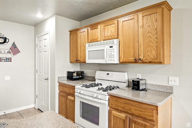 253 N 4300 W, Cedar City, UT 84720 - kitchen featuring white appliances, light tile patterned flooring, light stone counters, and a textured ceiling