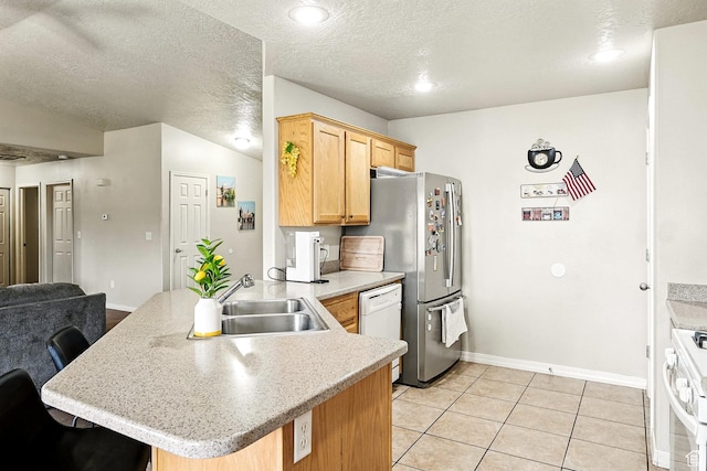 253 N 4300 W, Cedar City, UT 84720 - kitchen featuring white appliances, a peninsula, light countertops, light tile patterned flooring, and a textured ceiling