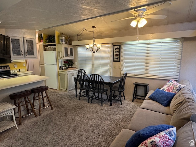 1225 N Dixie Downs Rd Unit 103, St George, UT 84770 - dining area with carpet flooring, vaulted ceiling, ceiling fan, and a chandelier