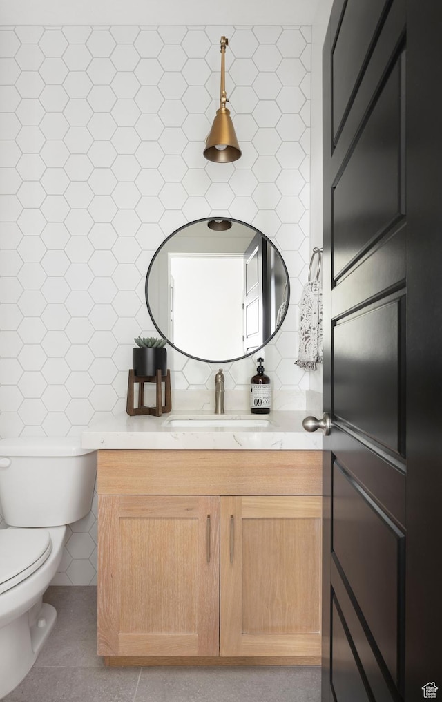 719 W Horizon Dr Unit 134, Lehi, UT 84048 - bathroom with vanity, tile patterned floors, backsplash, and tile walls