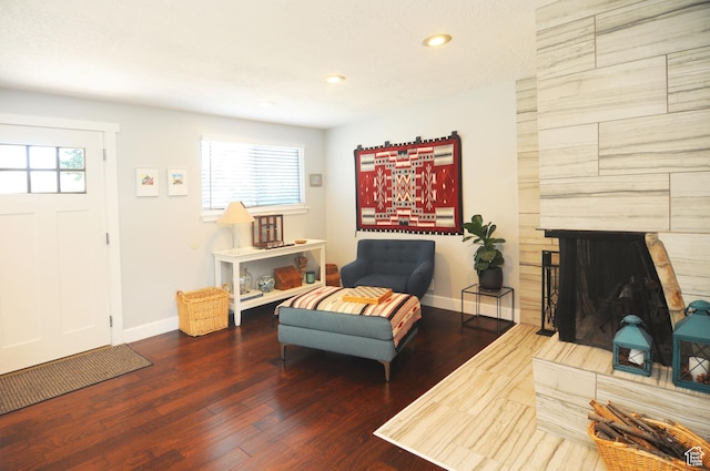 2845 Banbury Rd E, Cottonwood Heights, UT 84121 - living room with healthy amount of natural light, recessed lighting, wood finished floors, and a tile fireplace