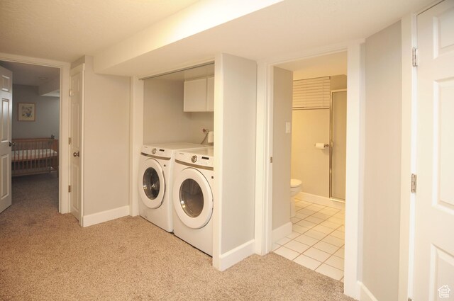 2845 Banbury Rd E, Cottonwood Heights, UT 84121 - washroom with independent washer and dryer, light colored carpet, and light tile patterned flooring