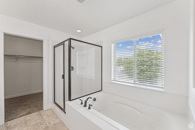 13316 S Moseley Way, Herriman, UT 84096 - bathroom featuring a shower stall, a bath, and a spacious closet
